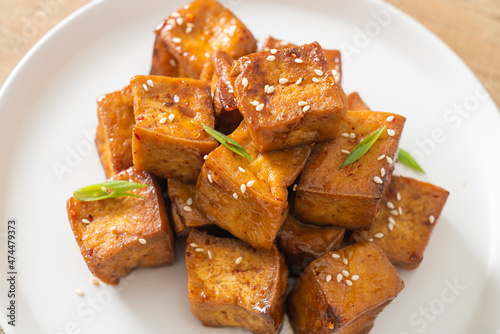 fried tofu with white sesame and teriyaki sauce photo