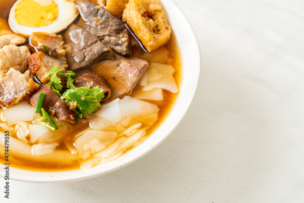 paste of rice flour or boiled Chinese pasta square in clear soup paste of rice flour or boiled Chinese pasta square in clear soup