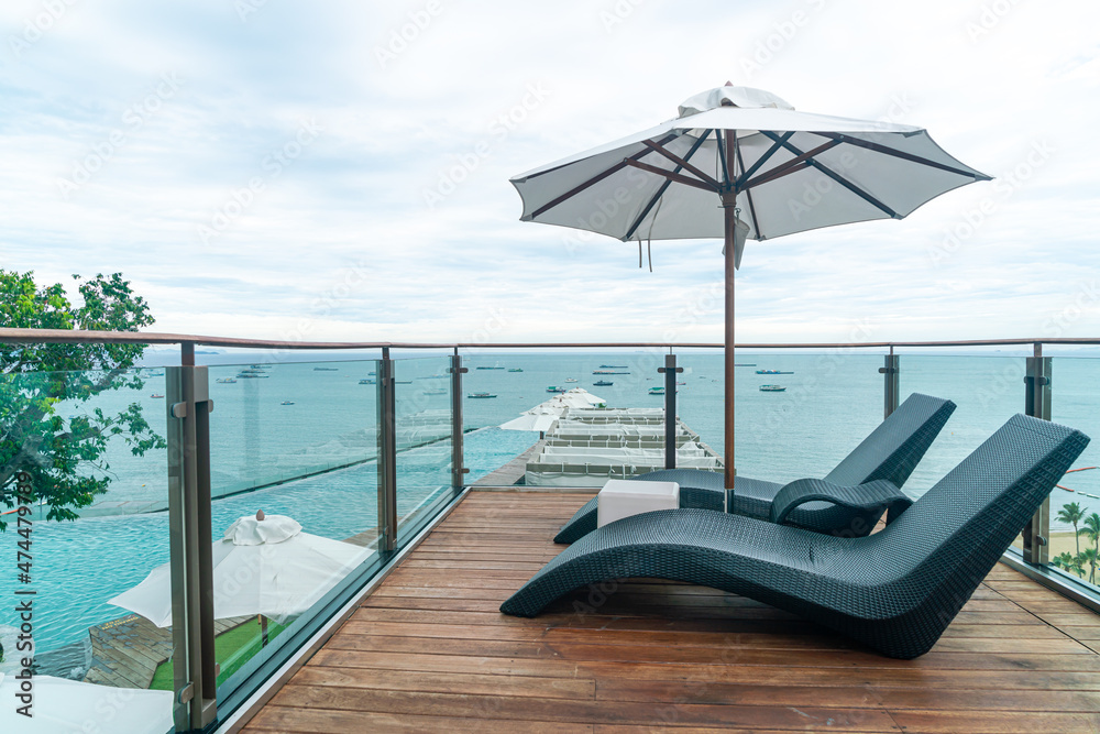 Fototapeta premium bed pool with umbrella around swimming pool