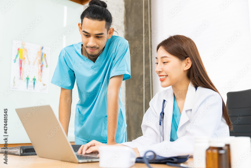Team of asian doctors and businesswoman having a meeting in medical office.Medical team interacting in conference room. Team of asian doctors and businesswoman having a meeting in medical office.Medical team interacting in conference room.