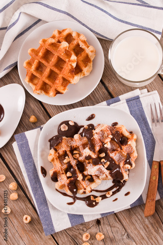 Waffles with chocolate cream and hazelnuts.