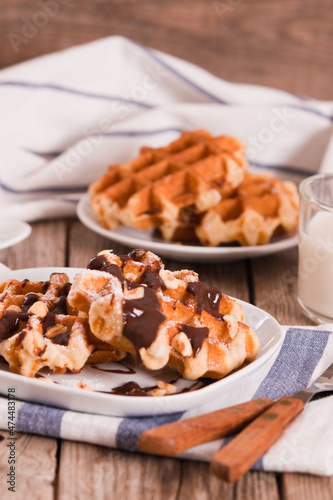 Waffles with chocolate cream and hazelnuts.