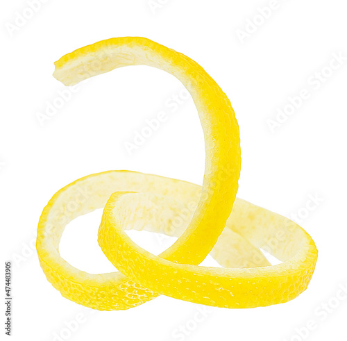 Twist of fresh ripe lemon isolated on a white background, close-up. Lemon peel.