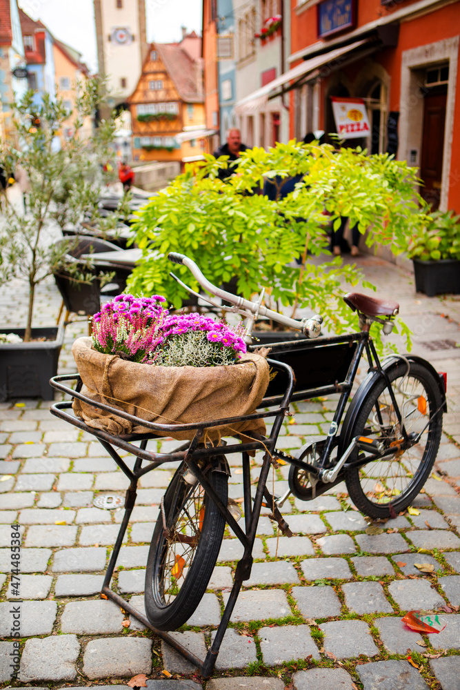 Germany, Rothenburg, fairy tale town, old streets, businesses, bicycles, flower baskets