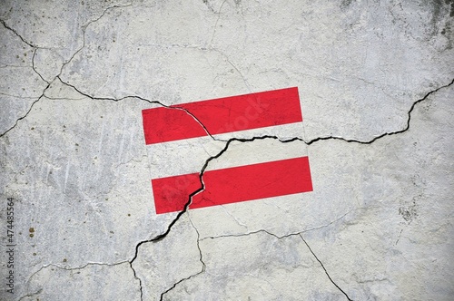 An old image of the flag of Austria on a wall with a crack.