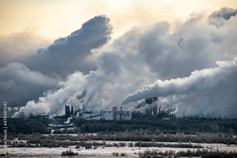 A panoramic view of a plant damaging the environment with hazardous emissions into the atmosphere.