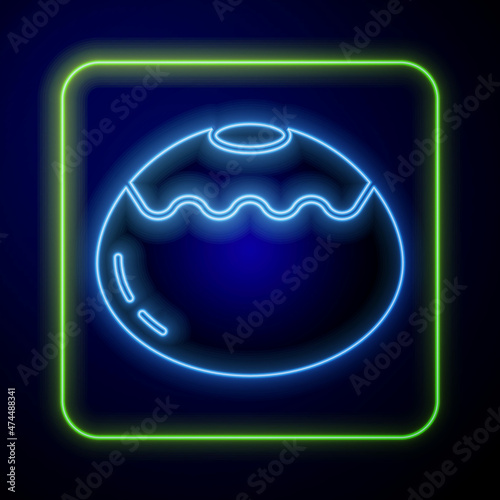 Glowing neon Jewish sweet bakery icon isolated on blue background. Hanukkah sufganiyot. Jewish easter cake. Vector