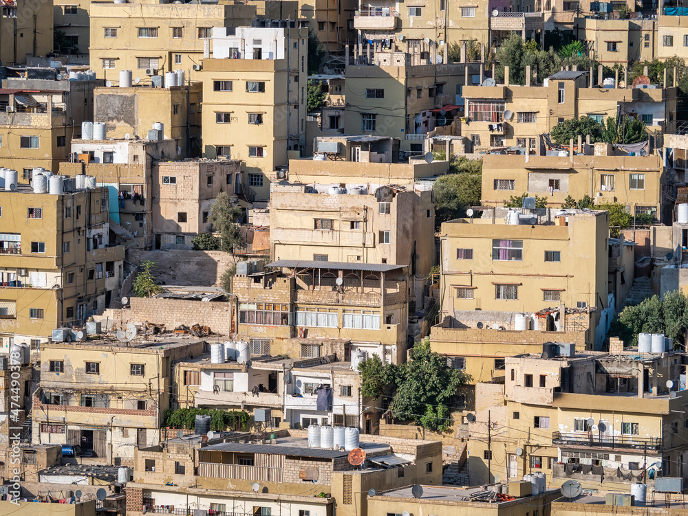 Close up detail with many crowded apartment buildings in Amman, Jordan.