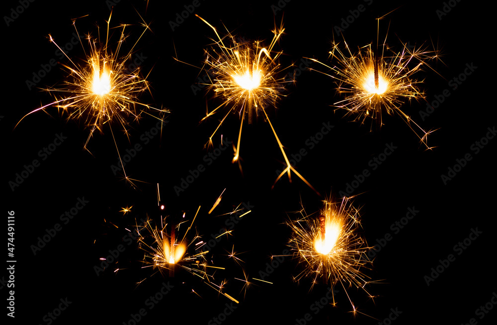 set of burning chrismas sparklers isolated on black