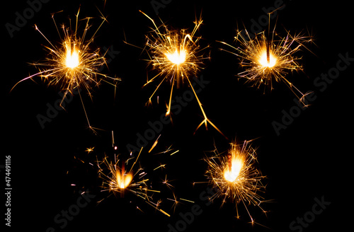 set of burning chrismas sparklers isolated on black