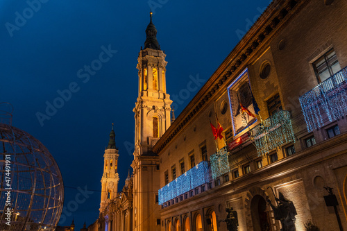 Towers illuminated at night in the Basilica of Our Lady of the Pillar in the city of Zaragoza, next to the Ebro river in Aragon. Spain