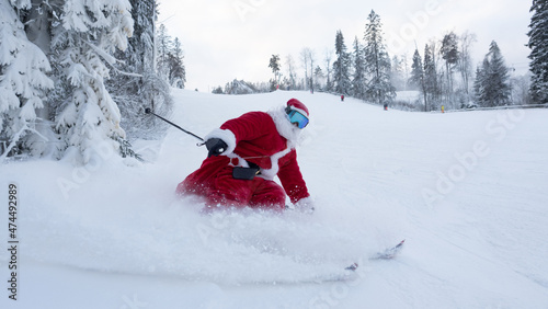 Santa Claus skiing downhill