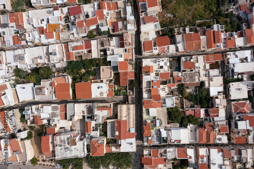 Top-down view of old Mediterranean town with small houses, tiled roofs, trees, Rethymno, Greece