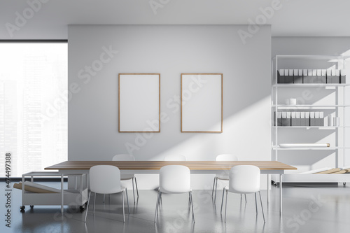 Bright office interior with two empty white posters, panoramic window © ImageFlow