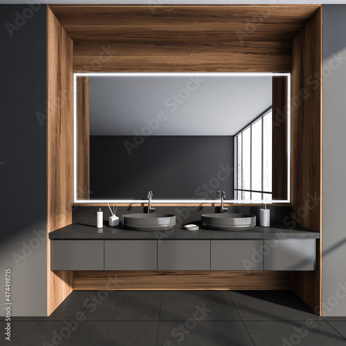 Dark bathroom interior with two sinks  mirror with reflection