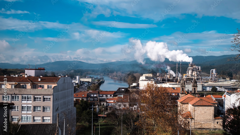 Factory smokestacks in Galicia, Spain.