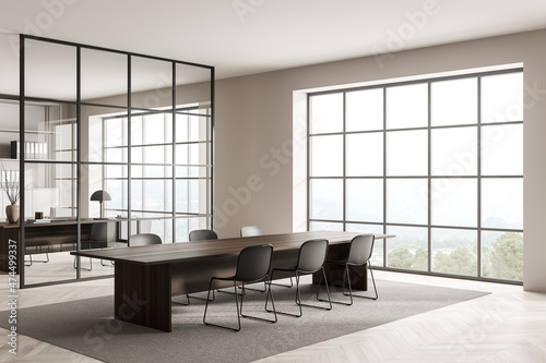 Bright office room interior with panoramic window, laptop