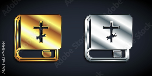 Gold and silver Holy bible book icon isolated on black background. Long shadow style. Vector