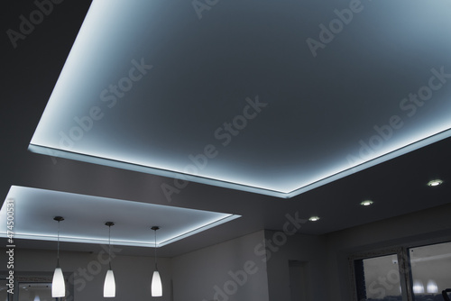 Fototapeta Naklejka Na Ścianę i Meble -  stretch ceiling with chandelier and lamps