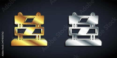 Gold and silver End of railway tracks icon isolated on black background. Stop sign. Railroad buffer end to destination. Long shadow style. Vector