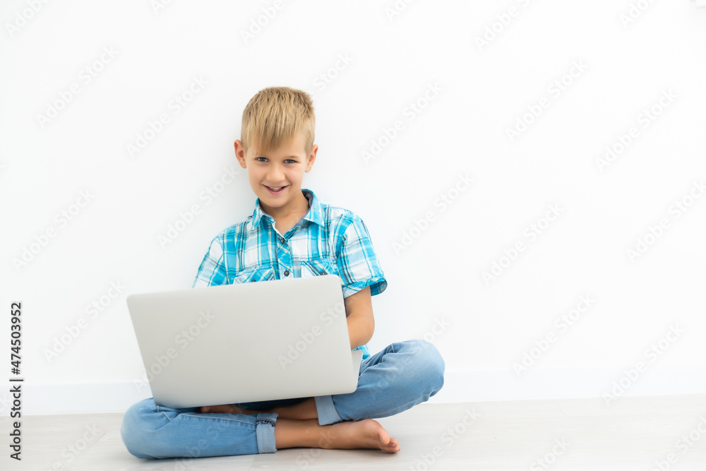 child looks carefully a video on the pc isolated on white child looks carefully a video on the pc isolated on white