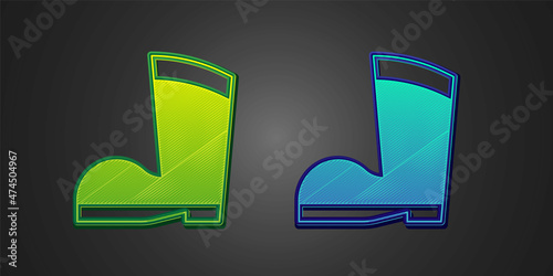 Green and blue Waterproof rubber boot icon isolated on black background. Gumboots for rainy weather, fishing, gardening. Vector