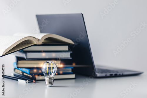 Bright light with book. Business success idea and studying concept photo