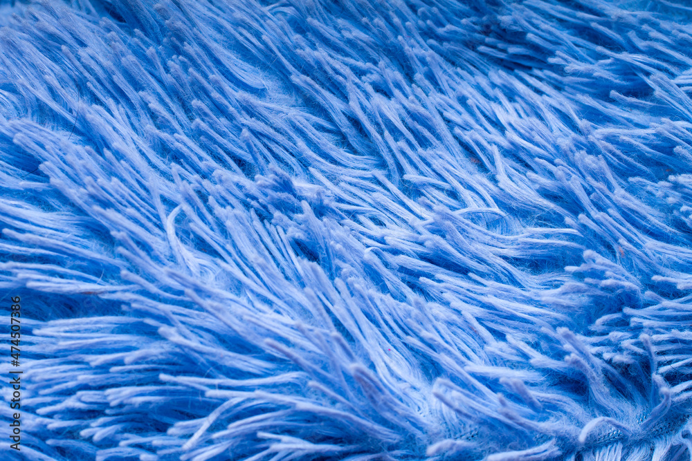 close-up of the villi and pile of a plush plaid or rug of a pale blue color for the decoration of backdrops close-up of the villi and pile of a plush plaid or rug of a pale blue color for the decoration of backdrops
