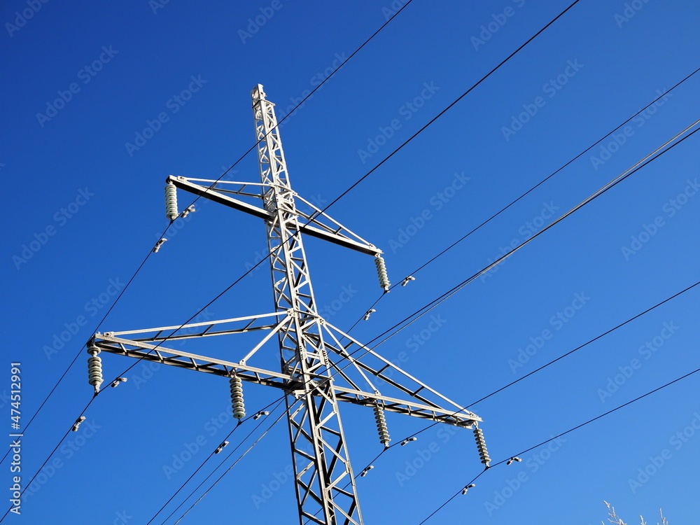 Winter landscape with frozen trees and a high-voltage power line in the Golden hour. Winter landscape with frozen trees and a high-voltage power line in the Golden hour.