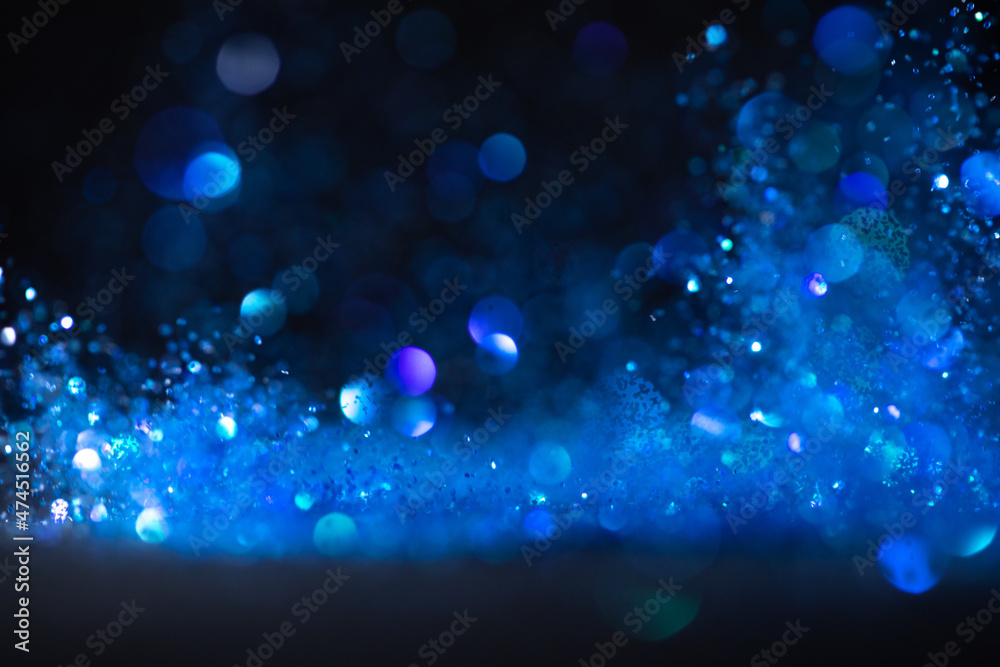 background of abstract blue glitter lights. defocused background of abstract blue glitter lights. defocused