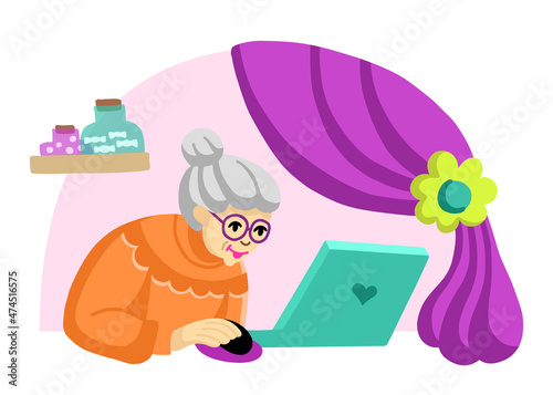 An old woman is working at a laptop at home in self-isolation. Grandmother communicates via social networks in a chat with grandfather.