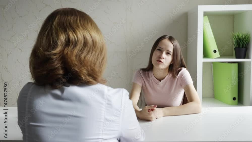 teenage girl at a psychologist's consultation talks about teenage problems, family affairs teenage girl at a psychologist's consultation talks about teenage problems, family affairs