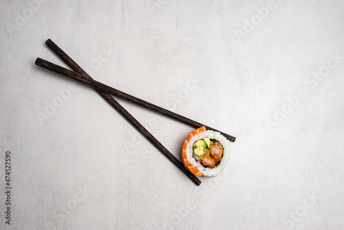Japanese cuisine sushi on a plain light green background Caesar salad with shrimp photo for the menu on a solid background pasta