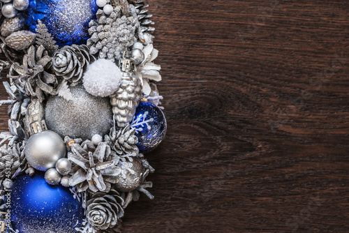 Part of christmas wreath on wooden surface