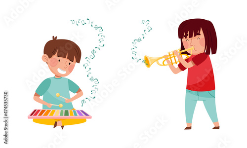 Cute kids playing music set.Boy and girl performing with xylophone and trumpet vector illustration