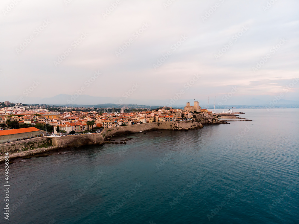Drone shot of the old city of Antibes. Cote d'Azur of the Mediterranean Sea of ​​France. Resort on the French Riviera Antibes. Picasso Museum. View from the drone yachts moored in the city marina.