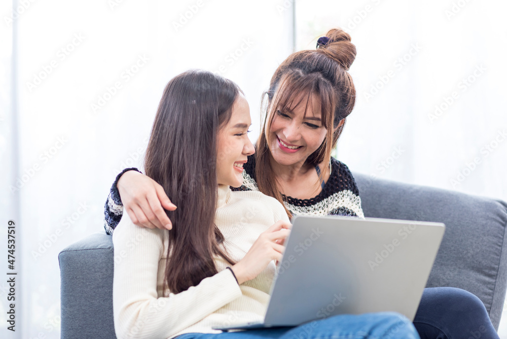Asian young lover lesbian couple doing planning wedding with computer notebook with happy in love moment in living room - LGBT relationship in daily lifestyle concept Asian young lover lesbian couple doing planning wedding with computer notebook with happy in love moment in living room - LGBT relationship in daily lifestyle concept