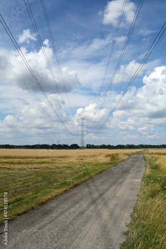 Kable energetyczne nad polem photo