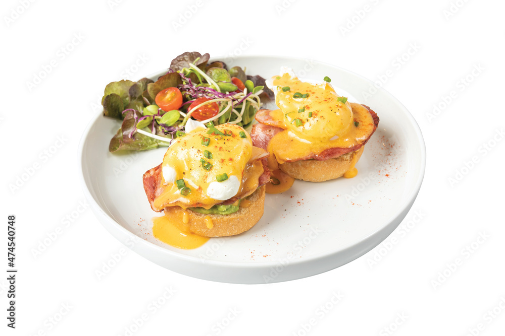 Eggs benedict with bacon on white plate. Eggs benedict with bacon on white plate.
