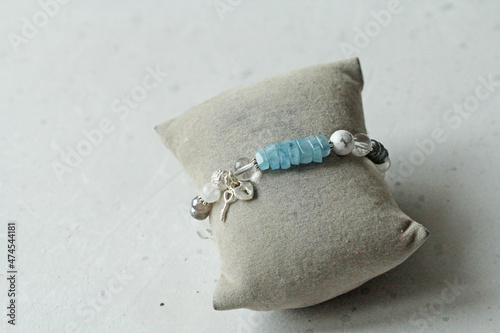 Beautiful asymmetrical designer bracelet made of natural stones and silver. Aquamarine, rock crystal, cacholong, larimar, moonstone. Handmade jewelry made from natural stones photo