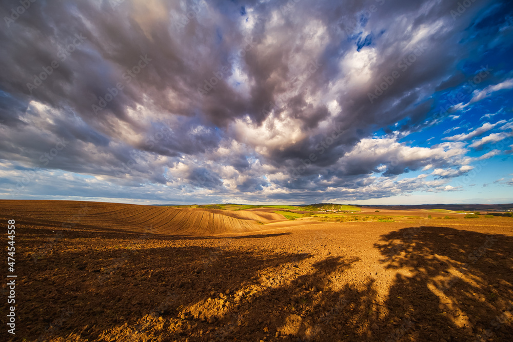 Autumn field with clouds. Agricultural landscape panorama. Moravian fields, Moravia, Czech Republic, around the village Kyjov
