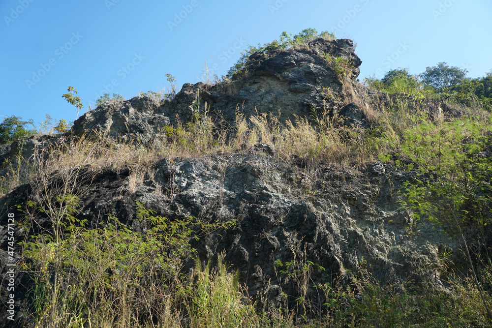 Serpentinite rocky mountain at Song Khwae District, Nan Province, Thailand. mountains full of serpentine. Serpentinite rocky mountain at Song Khwae District, Nan Province, Thailand. mountains full of serpentine.