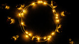 Garland christmas. Xmas party ornament decor with Golden light garland decoration, gold bulb isolated on black background. Christmas decoration and copy space for your text.