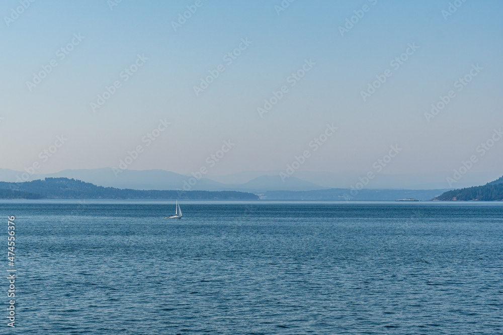 strait of Georgia between Vancouver and Victoria with small islands boats and blue sky strait of Georgia between Vancouver and Victoria with small islands boats and blue sky