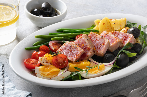 traditional French dish, nicoise salad with tuna, selective focus