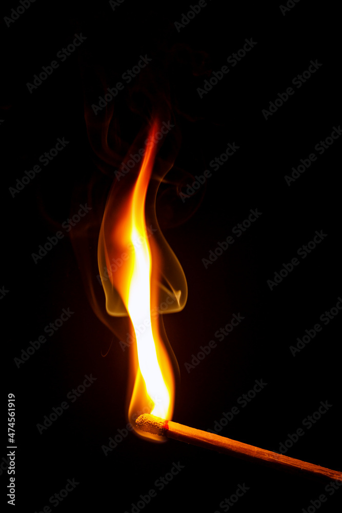 flame of a matchstick  on black background