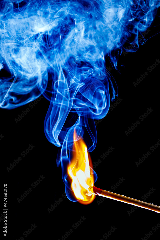 flame and smoke of a matchstick on black background flame and smoke of a matchstick on black background