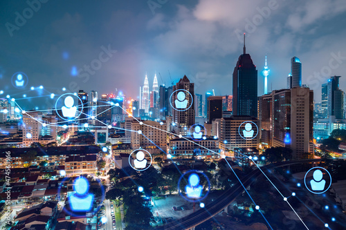Photography Glowing social media icons on night panoramic city view of Kuala Lumpur, Malaysia, Asia