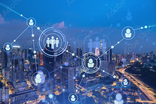 Photography Glowing social media icons on night panoramic city view of Kuala Lumpur, Malaysia, Asia