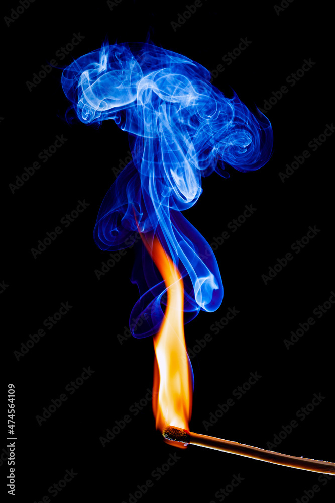 flame and smoke of a matchstick on black background flame and smoke of a matchstick on black background